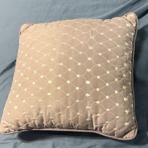 Mauve Quilted Throw Pillow square with some loose strings.